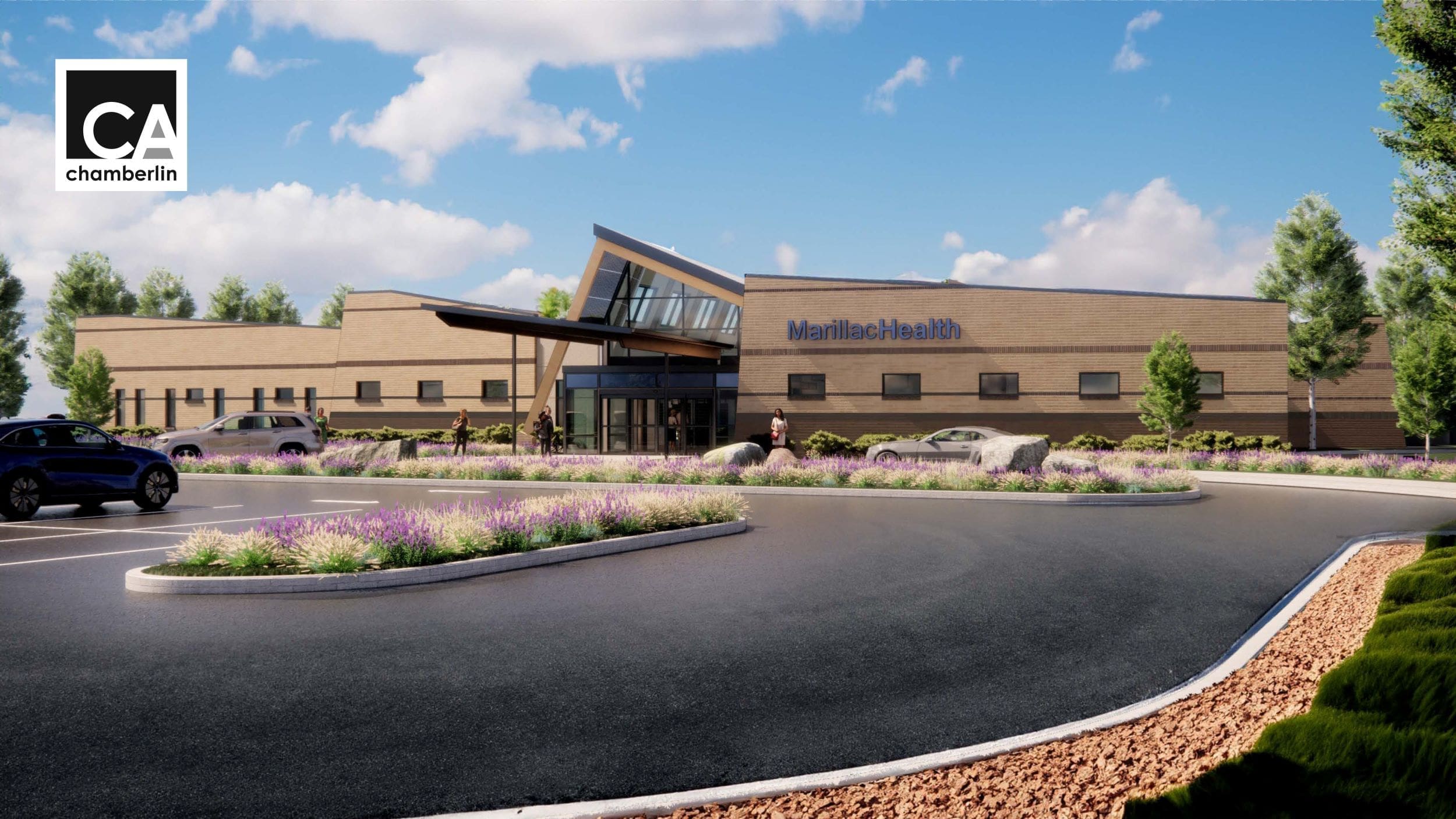 A modern healthcare building labeled MarillacHealth with large windows, landscaped gardens, and a circular driveway under a sunny sky. Several cars are parked nearby as people walk toward the entrance of this Grand Junction Health Care facility.