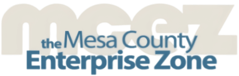 Logo with large, light text mcez in the background and overlapping blue text reading Mesa County Enterprise Zone in the foreground, representing our commitment to affordable health care for the community.